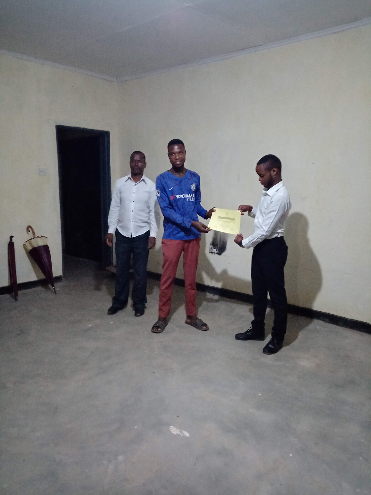 Teachers receiving certificates after completing the training