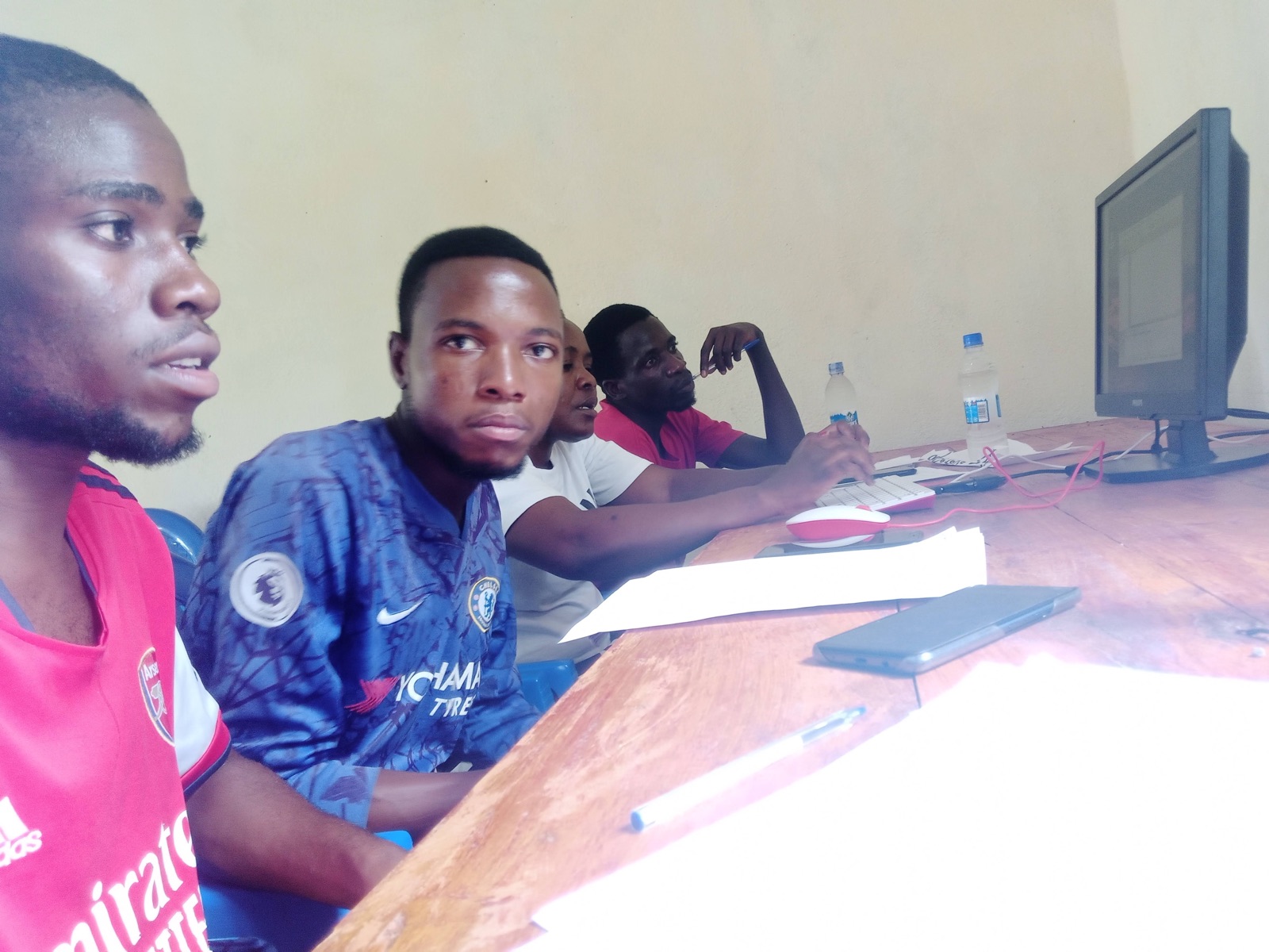 Teachers working at desktop computers during computer literacy training
